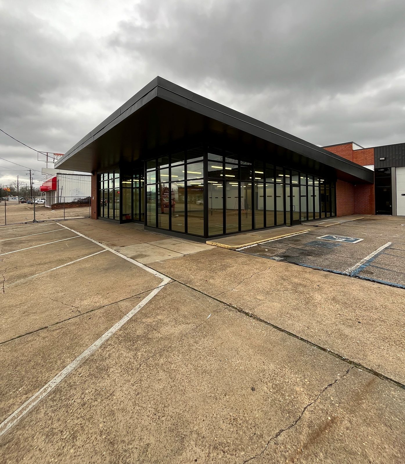 Fabricated commercial storefront with floor-to-ceiling insulated glass and black aluminum framing in Selma, AL