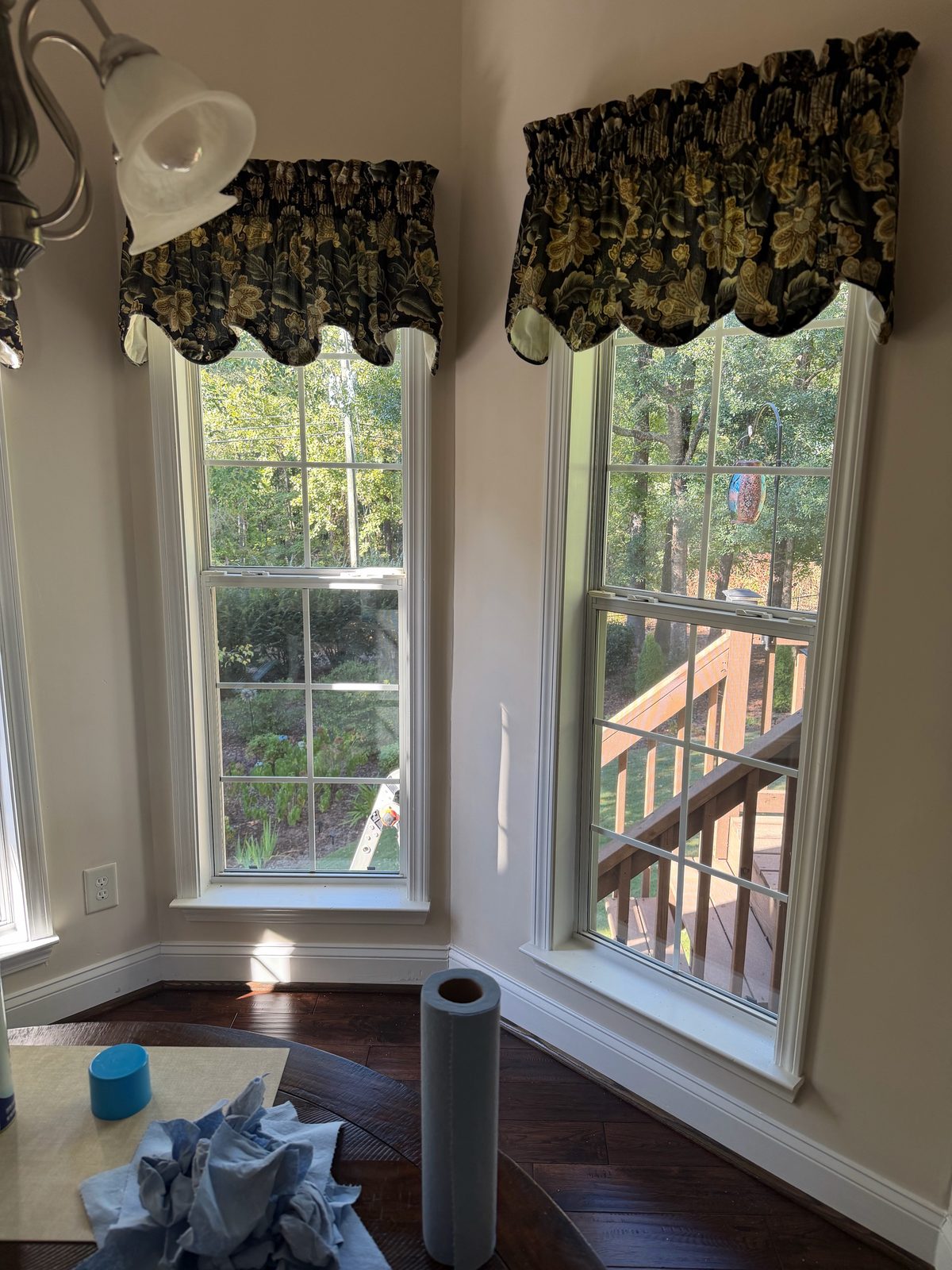 Two new white double-hung grid windows in a breakfast nook